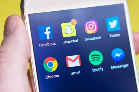 A phone showing the apps of popular social media sites